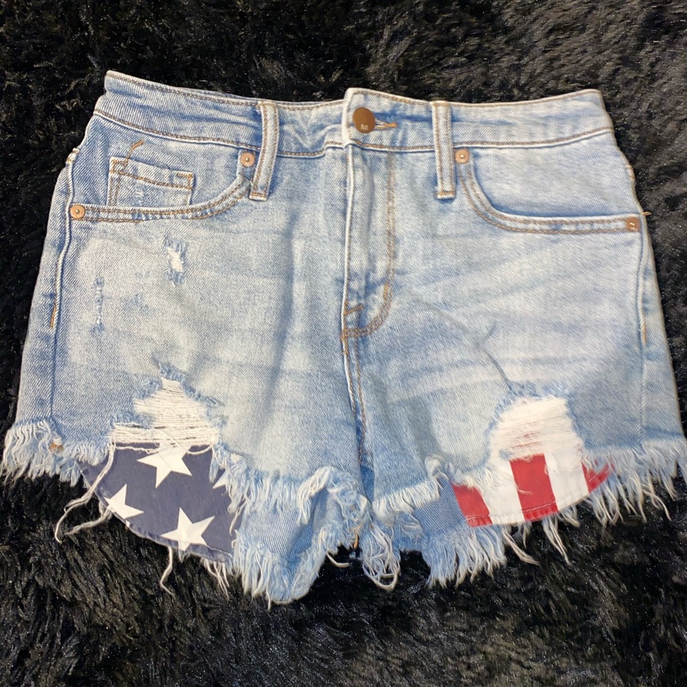 Blue distressed American flag pocket booty shorts